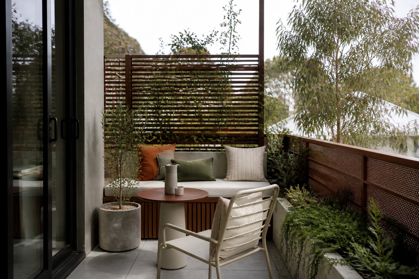 Compact balcony arranged as a planted outdoor room